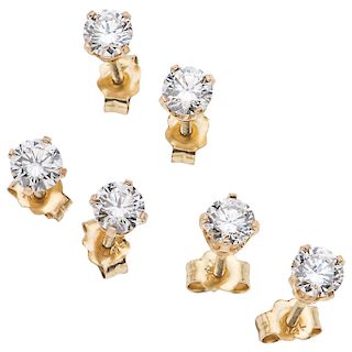 Three diamond 14K yellow gold pairs of stud earrings.