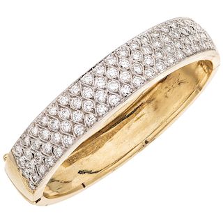 A diamond 16K yellow gold bangle bracelet.