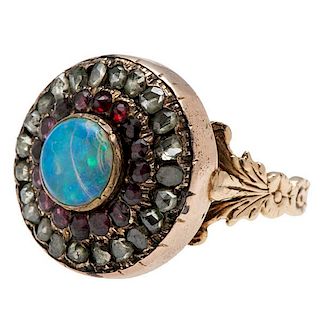 Ring with Rose Cut Diamonds, Garnets, and an Opal 