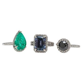 Rings in White Gold Including a 2.35 Carat Black Diamond, 8 Carat Tanzanite, and a 6.75 Carat Emerald 
