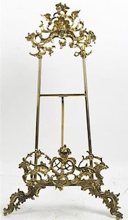 A Victorian Style Brass Easel, Height 28 inches.