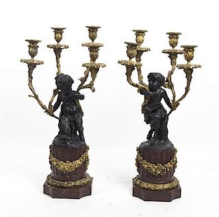 A Pair of Louis XVI Style Bronze and Marble Four-Light Candelabra, Height 20 3/4 inches.