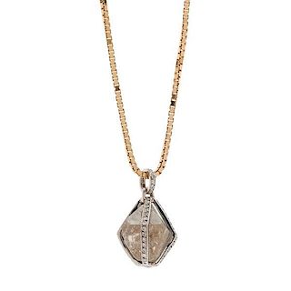 Pendant with an Uncut Diamond in a Gold and Diamond Cage 