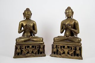 Pair of Brass Buddhas Seated on Lion Platforms.