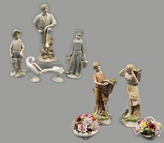 Lote de 9 figuras decorativas. Diferentes origenes. SXX Elaboradas en porcelana. Consta de: mujer y hombre, 2 bouquets, 2 cisnes, otros