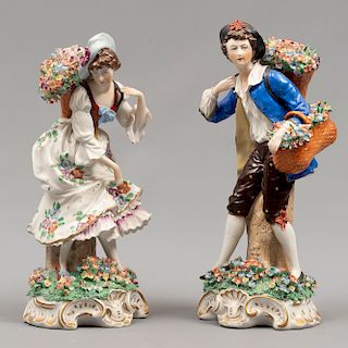 Campesino y campesina. Alemania. Siglo XX. Elaborados en porcelana. Acabado brillante. Dimensiones: 24 x 12 x 10 cm. (mayor)