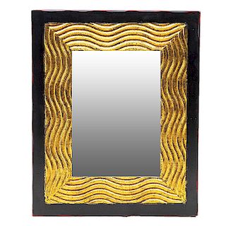 Espejo. Siglo XX. En talla de madera. Con espejo de luna rectangular. Decorado con esmalte dorado y elementos orgánicos.