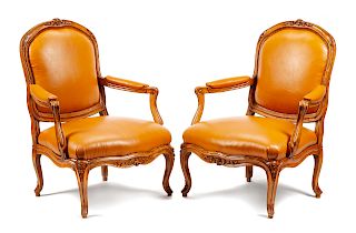 A Pair of Louis XV Leather Upholstered Beechwood Fauteuils