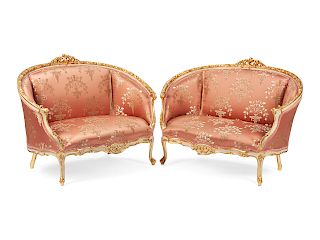 A Pair of Louis XV Style Painted and Parcel Gilt Settees