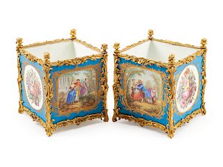 A Pair of Sevres Style Gilt Bronze Mounted Porcelain Planters