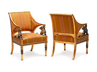 A Pair of Neoclassical Painted and Parcel Gilt Armchairs