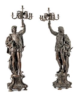 A Pair of French Patinated Metal Figural Torcheres 