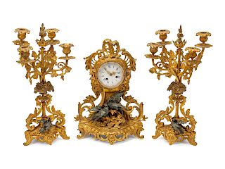 A French Gilt and Patinated Bronze Clock Garniture