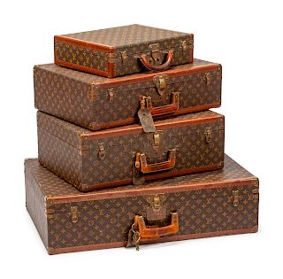 A Group of Four Louis Vuitton Hard-Sided Suitcases