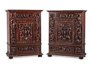 A Pair of Renaissance Revival Carved Walnut and Oak Cabinets