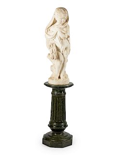 An Italian Carved Marble Figure of a Boy