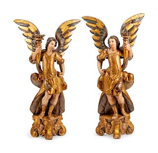 A Pair of Italian Painted and Parcel Gilt Figural Candlesticks
