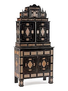 A Continental Pewter Inlaid and Ebonized Cabinet