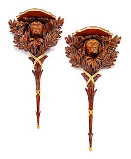 A Pair of Continental Parcel Gilt Carved Walnut Wall Brackets