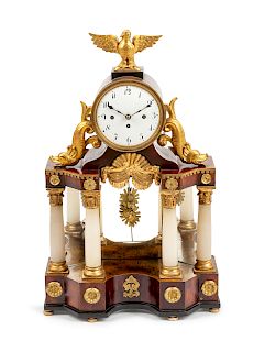 An Austrian Parcel Gilt Mahogany and Marble Mantel Clock