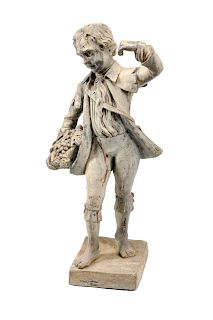 A Cast Lead Figure of a Boy with Grapes