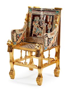An Egyptian Revival Painted, Parcel Gilt and Inlaid Throne Chair
