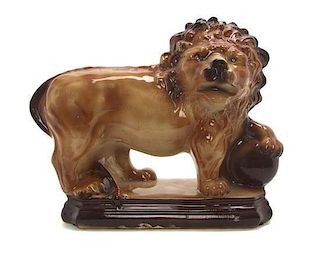 A Staffordshire Pottery Model of a Medici Lion, Width 14 1/2 inches.