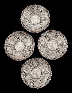 A Set of Four Silver Filigree Plates