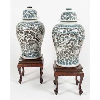 Pair of Monumental Lidded Jars with Phoenix Decoration on Hardwood Stands