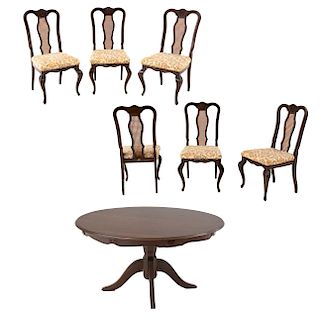 Comedor. México, siglo XX. De la marca Dixy. Consta de: Mesa. Elaborada en madera tallada. Cubierta circular con 6 sillas. Pz: 7