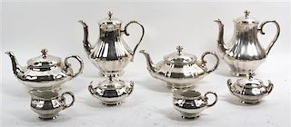 A Silvered Porcelain Tea and Coffee Service, Height of tallest 9 1/2 inches.