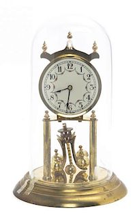 * A Perpetual Motion Clock, Height overall 12 1/2 inches.