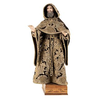 SAINT AMBROSE. MEXICO, 19TH CENTURY. Carved and polychromed wood figure. Clothing with gold embroidery. With a wooden base and glass cover.