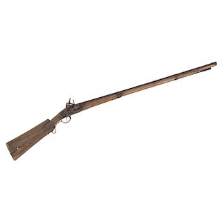 MUSKET. 18TH CENTURY. Iron and wood with golden floral details. 