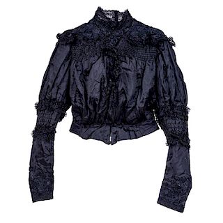 BLAZER AND BLOUSE. CIRCA 1900. Black blazer and blouse with lace details. 