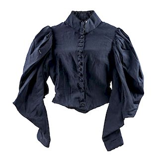 A PAIR OF BLAZERS. CIRCA 1900. Black blazers with rigid bodice (corset-like structure) and lace details. 