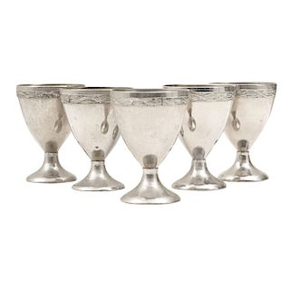MINIATURE WINE GLASSES. XX CENTURY. In silver metal. Decorated with valances as pods. Pieces: 5