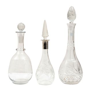 LOT OF DECANTERS. XX CENTURY. In transparent cut glass. Frosted and ribbed designs. Pieces: 4