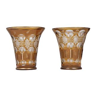 Pair of vases. CHECOSLOVAQUIA, FIRST HALF OF XX CENTURY. In amber BOHEMIA crystal. With floral patterns. Pieces: 2