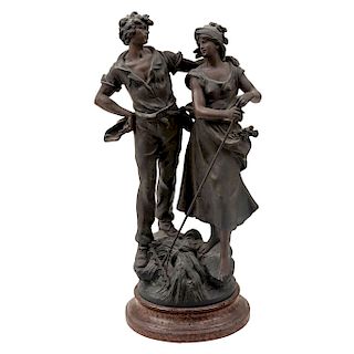 L & F MOREAU. FARMERS COUPLE. Cast iron in antimony, with cold patina. With marble type wood base.