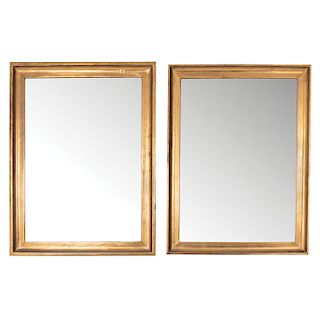 PAIR OF MIRRORS. XX CENTURY. Made of golden wood, with beveled moon.