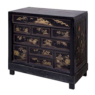 COMFORTABLE. XX CENTURY. CHINESE STYLE. Made of ebonized wood. With rectangular cover, 9 drawers and straight supports