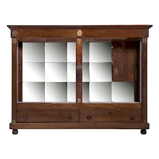 SHOWCASE. PRINCIPLES OF THE XX CENTURY. EMPIRE style. Made of carved wood. 2 lower drawers, quadrangular moons.