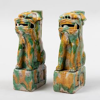 Pair of Chinese Green and Yellow Glazed Buddhistic Lion Porcelain Candleholders