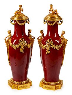 A Monumental Pair of Gilt-Bronze-Mounted Sang de Bouef Porcelain Vases and Covers