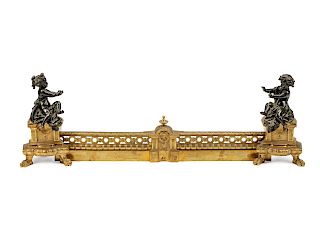 A Pair of Louis XVI Style Parcel-Gilt and Patinated Bronze Chenets and Fender