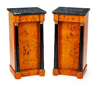 A Pair of Empire Style Parcel-Gilt and Ebonized Birch Nightstands