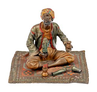 An Austrian Cold-Painted Bronze Figure of a Seated Merchant