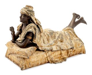 A Large Cold-Painted Metal Erotic Figure of a Reclining Woman