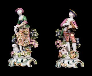 A Pair of Chelsea Porcelain Figures of a Boy and Girl